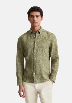 Long-sleeve shirt in olive green with a subtle floral pattern. Features a button-down collar and front buttons for closure.