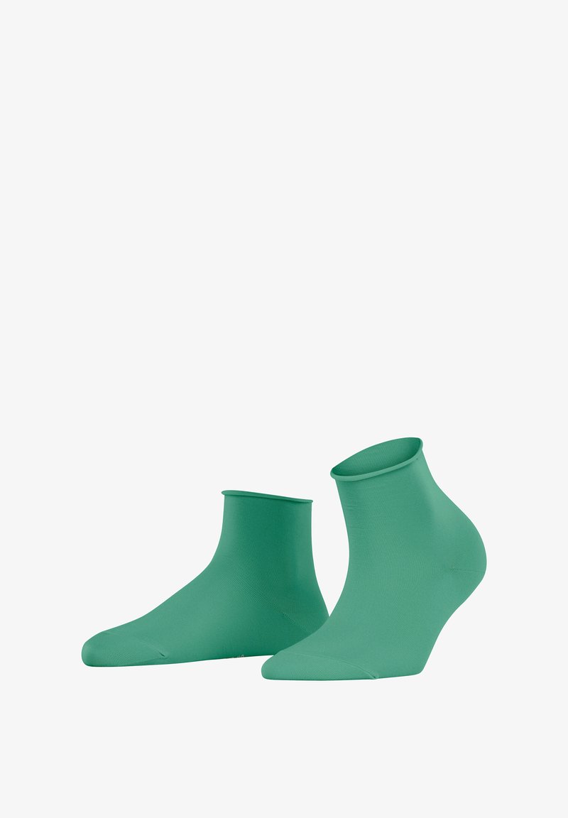 Grüne Knöchelsocken mit einer glatten, dehnbaren Textur und einem körpernahen Design, die eine abgerundete Zehenpartie und eine mittelhohe Bündchenhöhe aufweisen.