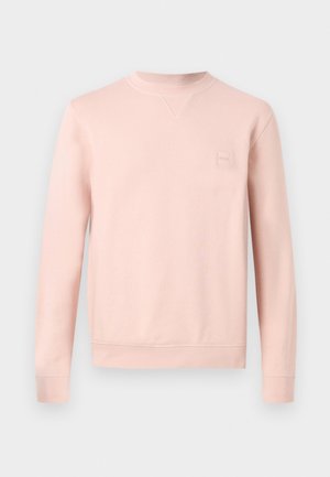 Ανοιχτό ροζ φούτερ με στρογγυλή λαιμόκοψη, μακριά μανίκια, ριμπ μανσέτες και στρίφωμα, και διακριτικό λογότυπο στην αριστερή πλευρά του στήθους.