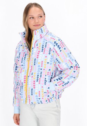 Padded jacket with a blue base, featuring a multi-color heart pattern in pink, yellow, and navy. Includes a high collar and zipper closure.