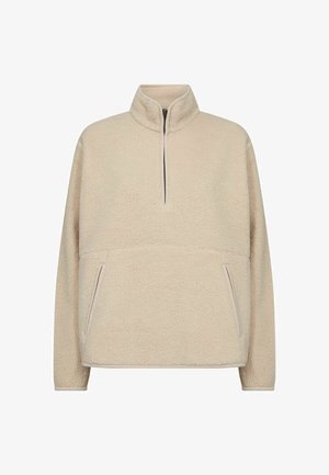 Beiger Fleece-Pullover mit hohem Kragen und Halbreißverschluss. Verfügt über zwei Seitentaschen und kontrastierende Paspelierung entlang der Kanten. Weicher, strukturierten Stoff.