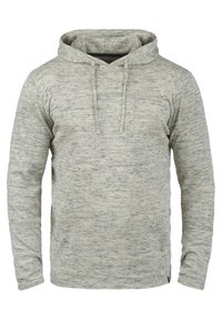 Siva i krem majica s kapuljačom od teksturiranog, melange materijala, sa prednjim kengur džepom i podesivom kapuljačom. Dugi rukavi.