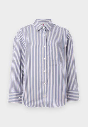 Camicia a righe blu e bianche con colletto, maniche lunghe e taschino anteriore con una piccola etichetta. Bottoni lungo la parte anteriore.