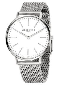 Montre bracelet en maille argentée avec un cadran blanc, présentant des marqueurs d'heure minimalistes, trois diamants décoratifs et un boîtier en acier inoxydable poli.