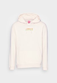 Ljusrosa hoodie av mjukt tyg med en framficka, dragsko på huvan och tryckt "Santa Cruz"-text i orange och grön.