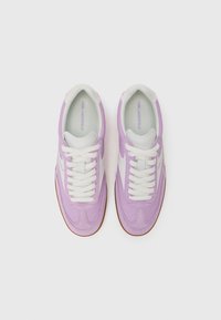 Lavender and white sneakers with a smooth leather upper, round toe, and white laces. Gum rubber sole and subtle branding on the insole.