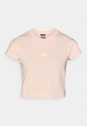 Cropped pink cotton t-shirt with a round neckline and short sleeves, featuring a white three-stripe logo on the chest.