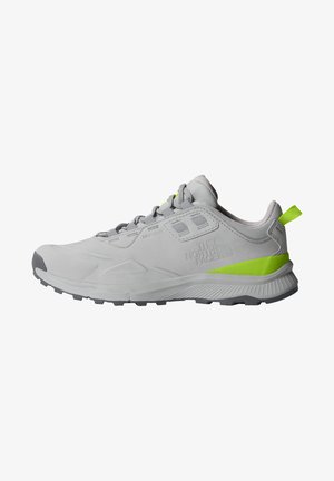 Chaussure de randonnée gris clair et vert néon avec design à lacets et semelle épaisse crantée, marquée du logo The North Face sur le côté.