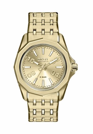 Montre Diesel ton or avec lunette octogonale, index numériques et bâtons pour les heures, bracelet en maillons métalliques, et trois aiguilles indiquant 10:09:36.