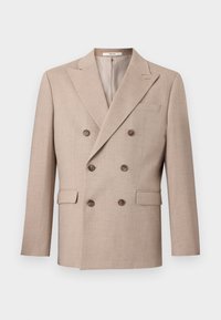 Beige double-breasted blazer made from textured fabric. Features two front pockets, brown buttons, and a notched lapel.