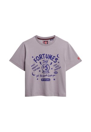 Light purple short-sleeve t-shirt with a round neckline. Features a graphic print in dark purple, with mystical text and symbols.