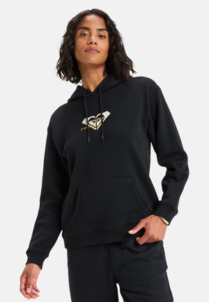 Black hoodie made of soft material featuring a front pocket, adjustable drawstring hood, and a gold logo design on the chest.