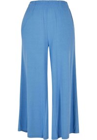Light blue, wide-leg pants made from soft fabric. Features an elastic waistband and a flowy silhouette, designed for comfort and ease.