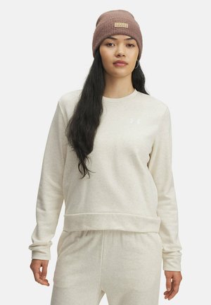Sweatshirt beige clair à manches longues et col rond, arborant un logo discret sur la poitrine. Tissu doux avec une coupe décontractée.