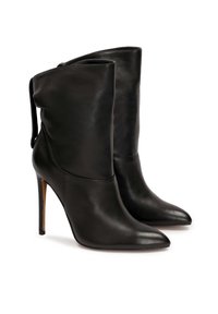 Black leather high-heeled ankle boots with a pointed toe, soft upper, and sleek silhouette, featuring a slouched design and narrow shaft.