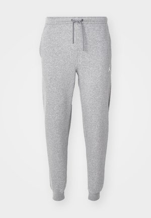 Harmaat verkkarit, joissa on säädettävä nyöri vyötäröllä, kavennetut lahkeet ja sivutaskut. Ylhäällä reidessä on pieni valkoinen logo.