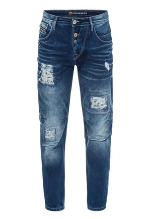 Blaue Jeans aus Denim mit einem distressed Look, die mehrere Risse und Patches aufweisen. Fünf-Taschen-Design mit Knopfverschluss und ausgebleichten Details.