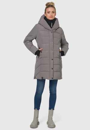 Gray puffer coat featuring a large hood, quilted design, button closure, and side pockets, paired with dark jeans and gray ankle boots.