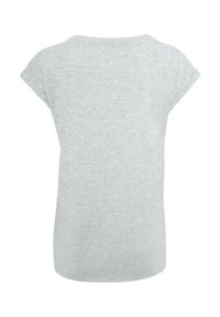 Grå kortærmet t-shirt med løs pasform. Lavet af et blødt, let stof. Har en rund halsudskæring og rullede ærmekanter.