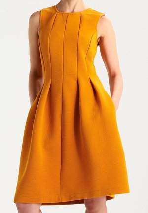 Trikoomekko - yellow