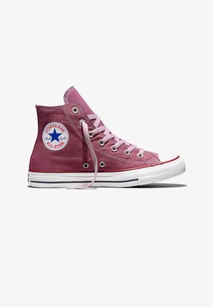 Zapatilla Converse All Star de caña alta en color malva con cordones blancos, suela de goma blanca y parche con logo de estrella azul en el tobillo.