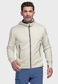 Helle graue Zip-Hoodie mit schwarzen Akzenten, ausgestattet mit einem hohen Kragen, zwei seitlichen Reißverschluss-Taschen und einem strukturierten Stoff für Atmungsaktivität.