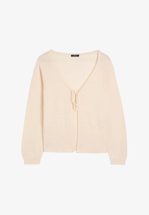 Kremowy sweter z dzianiny o głębokim dekolcie w kształcie V, z zapięciem na wiązanie oraz prążkowanymi mankietami i dołem. Miękka tekstura, luźny krój, bez wzorów ani akcentów.
