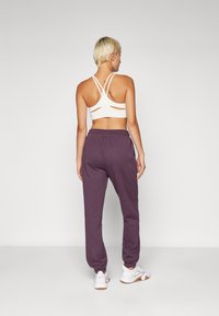 Fabletics COZY GO TO SWEATPANT - Donji dijelovi trenirke - deep plum