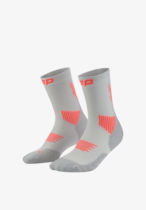 Gray athletic socks featuring bright neon pink stripes and accents. Structured ribbed design with reinforced toe and heel areas.