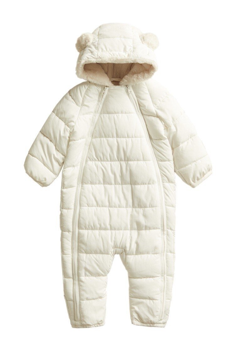Padded all-in-one suit in cream with a hood, featuring bear ear accents, zip closures, and quilted texture for warmth and comfort.