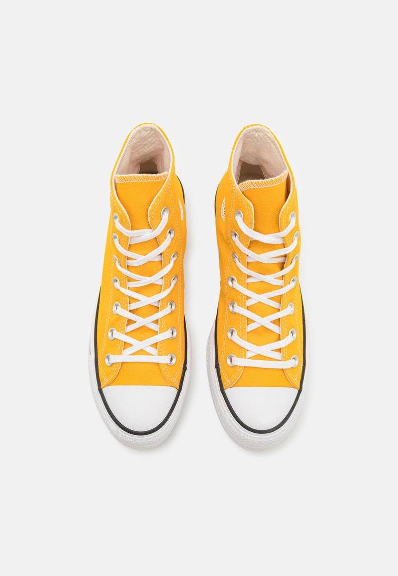 yellow low top chuck taylors