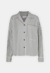 Striped button-up shirt with long sleeves, black and white stripes, notch collar, single chest pocket, and textured fabric.
