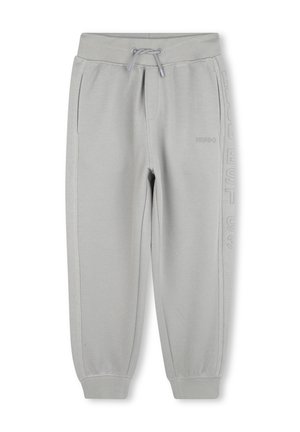 Pantalons de jogger texturés gris clair avec taille élastique, cordon de serrage, poches latérales, poignets côtelés, et logo "HUGO" discret sur la jambe droite.