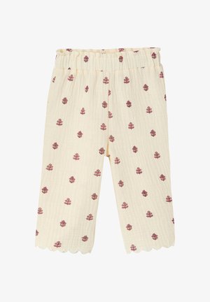 Cream-colored children's pants with elastic waistband, pink floral pattern, textured fabric, and scalloped hems.