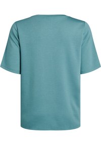 Tyrkysové tričko s krátkým rukávem vyrobené z měkké tkaniny. Kulatý výstřih, volný střih a prošívaný lem. Jednoduchý design bez vzorů nebo akcentů.