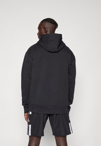 adidas Performance JAMAICA JFF SZN DK HOODIE - Džemperis ar kapuci - black