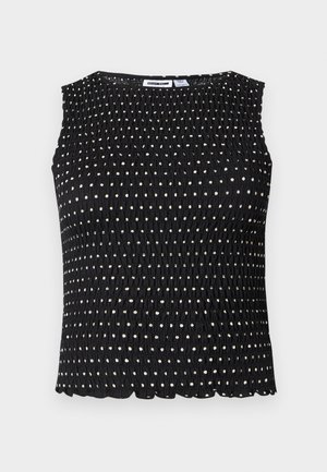 Μαύρο αμάνικο τοπ με υφή σμόκινγκ και μικρές λευκές πουά, με στρογγυλή λαιμόκοψη και κυματιστό κάτω μέρος.