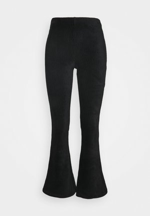 Mustat samettimaiset laskostetut housut, joissa on pystysuuntainen ribbitekstuuri, joustava vyötärö ja tiukka muotoilu reiden ympäri.