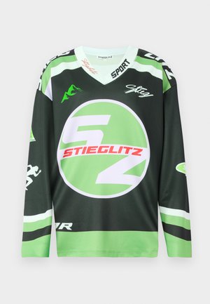 Zelený a čierny dlhý rukáv dres s kruhovým logom, výraznou bielou a červenou grafikou a dizajnom v-neck. Vyrobené z priedušného materiálu.