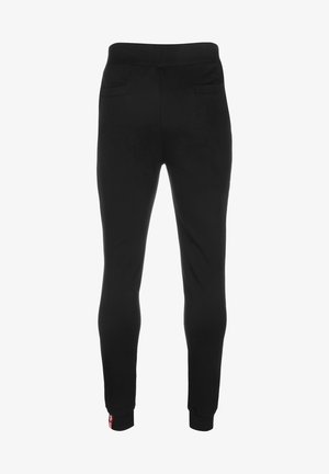 Pantaloni jogging neri realizzati in tessuto morbido, con una superficie liscia, cintura elastica e due tasche posteriori. Caviglie semplici con polsini.