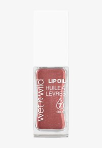 Durchsichtige rechteckige Flasche mit Lippenöl in einem rosafarbenen Schimmer, ausgestattet mit einem weißen Deckel und etikettiert mit Marken- und Produktdetails.