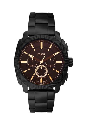Reloj de pulsera negro Fossil con correa de eslabones metálicos, bisel texturizado, tres subesferas, manecillas y marcadores de hora en tono dorado, mostrando la hora 9:08:35.