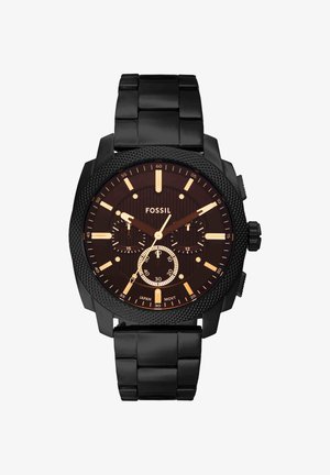 Montre-bracelet Fossil noire avec bracelet à maillons métalliques, lunette texturée, trois sous-cadrans, aiguilles et index dorés indiquant 9:08:35.