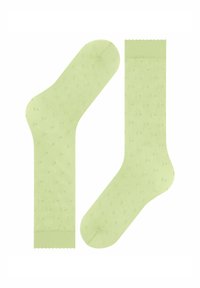 Helle grüne, knöchellange Socken mit einer transparenten Textur und kleinen, erhabenen Punkten. Verfügt über gewellte Ränder und eine glatte Oberfläche.