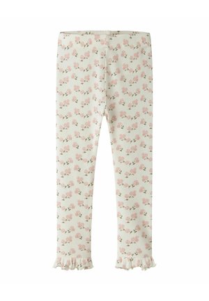 Leggings blancs côtelés avec un petit motif floral rose et des ourlets à volants, conçus pour les enfants.