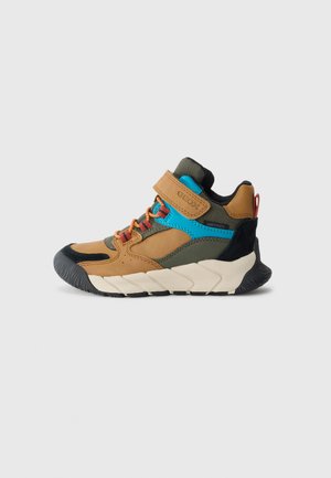 Brown, green, and blue high-top children's sneaker with orange laces, Velcro strap, and thick white sole with black tread.