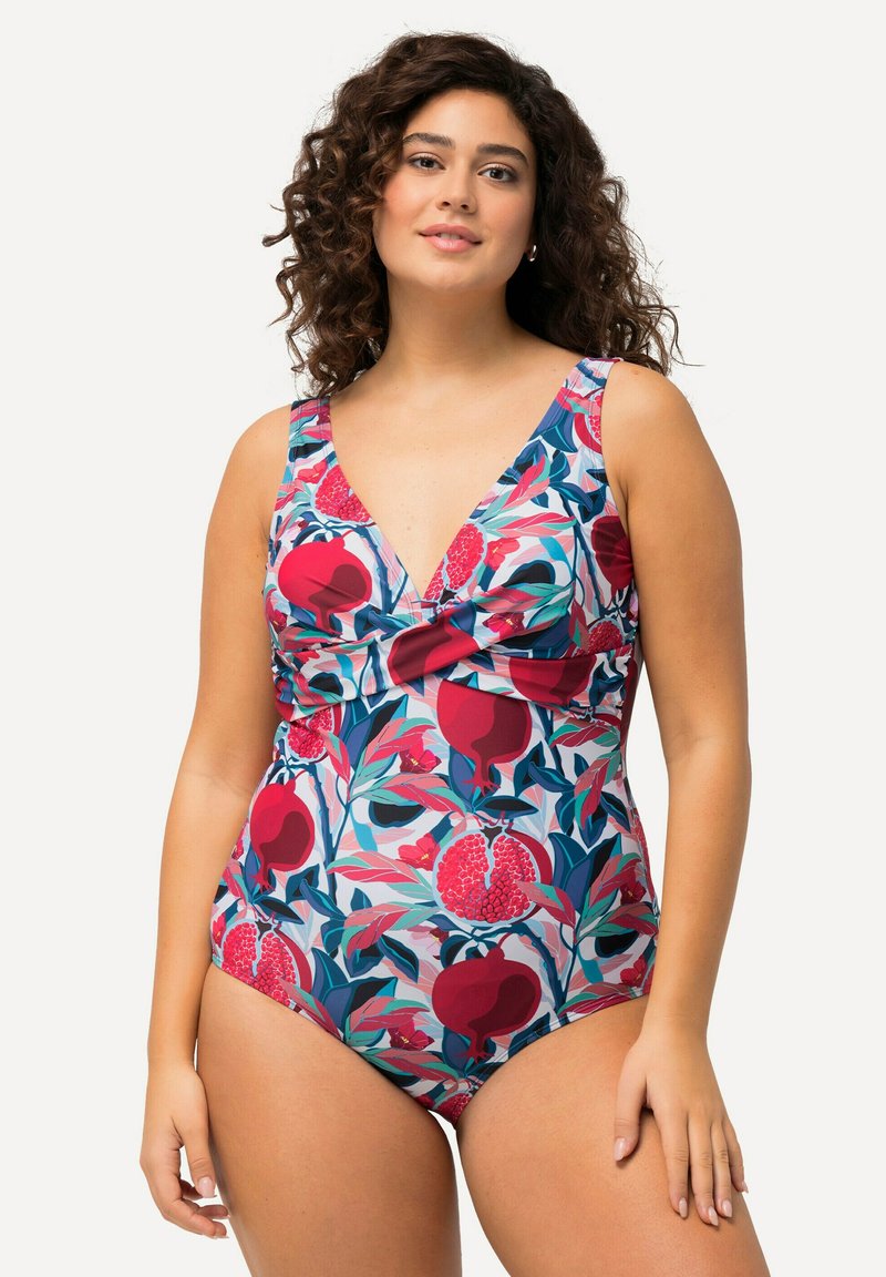 Eén stuk badpak met een diepe V-hals, bloemenpatroon in roze, rood en groen, met ruches aan de voorkant en brede bandjes.