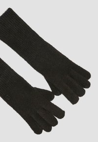 Schwarze Strickhandschuhe mit geripptem Muster. Verfügen über separate Fingeröffnungen und eine weiche, flauschige Oberfläche. Die Länge reicht über das Handgelenk hinaus.