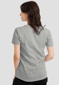 Gray short-sleeved T-shirt, made of soft, textured fabric, with a crew neckline and a relaxed fit, viewed from the back.