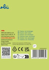 Grüne Verpackung für ein Kindertraktor-Spielzeug mit Text in mehreren Sprachen, Barcodes und Sicherheitszertifizierungs-Ikonen.